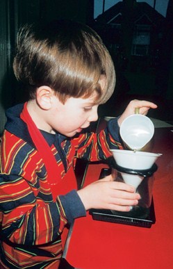A child pouring water