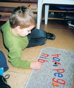 A child building his words on his own