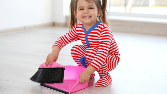 Girl with dustpan