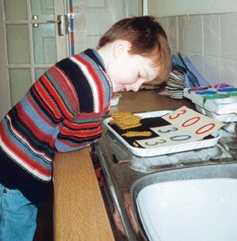 A child using golden beads